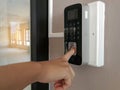 TheÃ¢â¬â¹ Hand of people and electronic digital door,finger print scan for unlock door security system Royalty Free Stock Photo